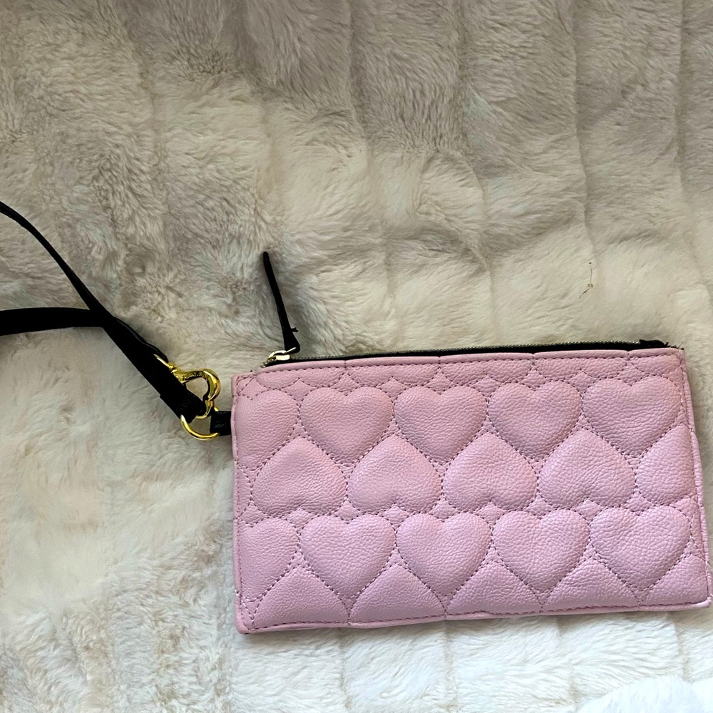 Cute Betsey Johnson clutch to take on a night out and can carry necessary items.